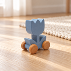 Blue Tulip Wooden Car on a wooden floor beside a woven rug